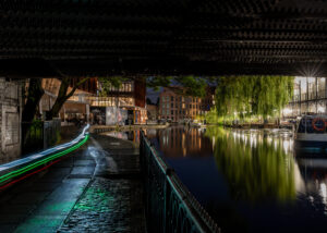 A canal under the tunnel in Camden Town at night, London