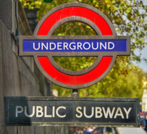 The famous London underground sign with the 'public subway' below the red circle