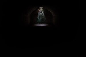 spotlight at the end of dark tunnel
