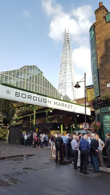 Borough market entrance with the Shard in the background.