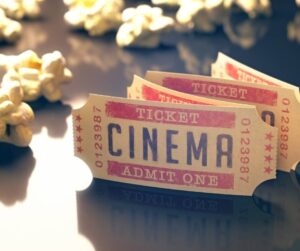 cinema tickets and popcorn on a table