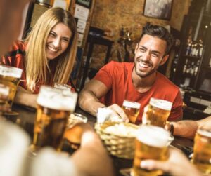 Happy friends drinking beer 