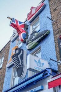 Big shoes on a blue wall in Camden, London