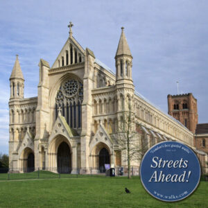 St Albans Cathedral exterior with Gothic architecture and London Walks “Streets Ahead” roundel