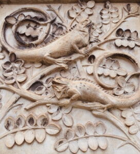Decorative stone carvings of reptiles and foliage at London’s Natural History Museum